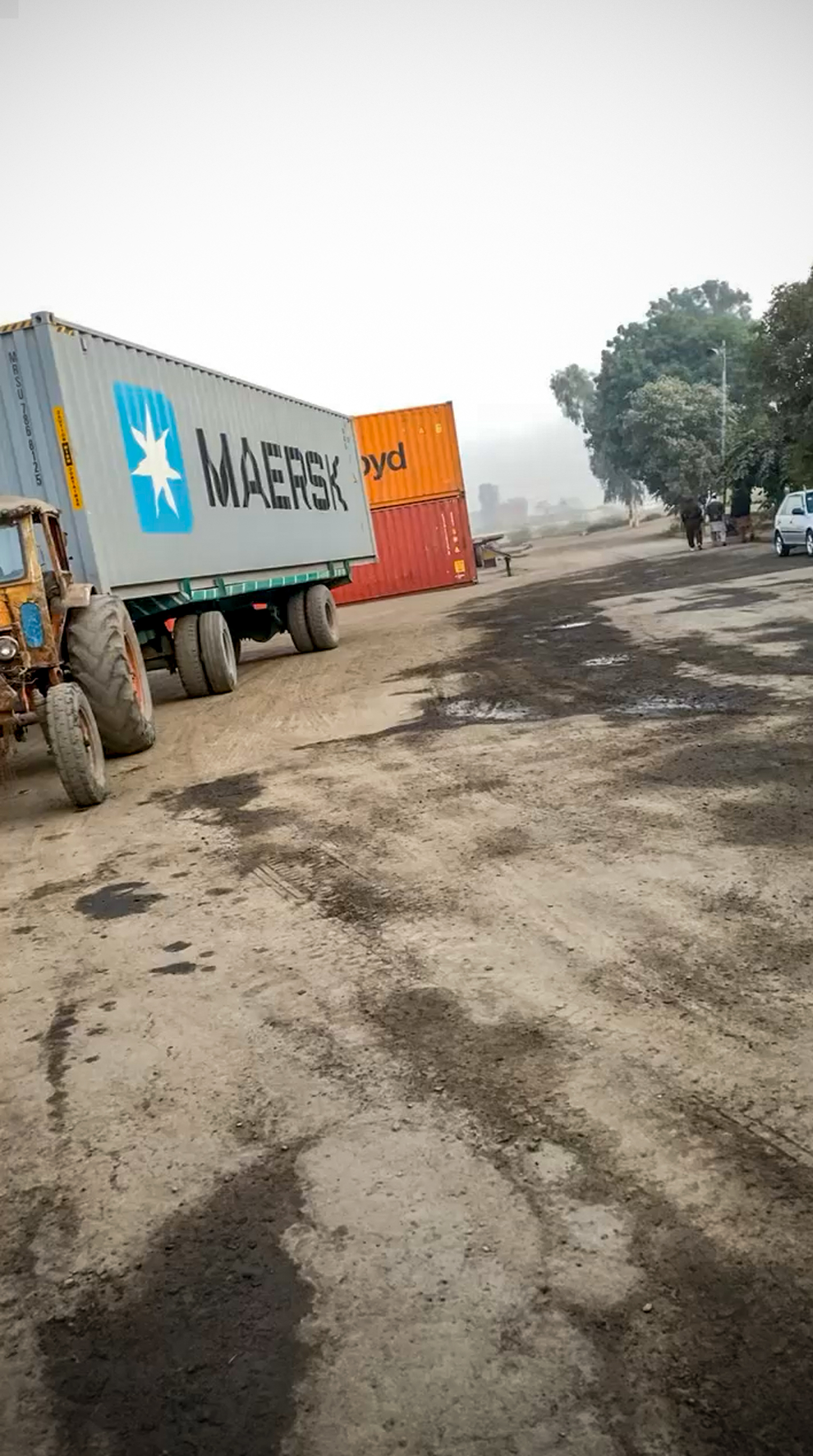 Geniluxe shipping container loaded on truck heading to sea port