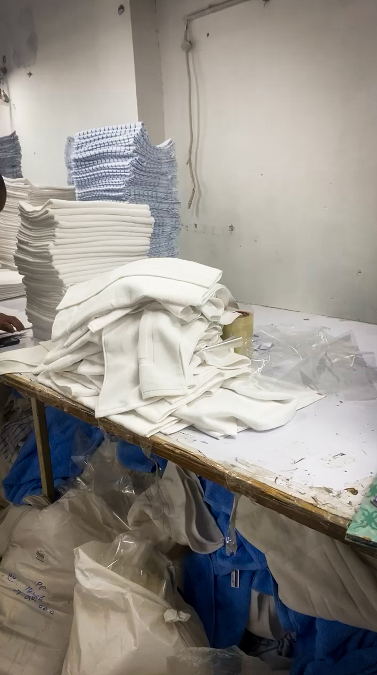 Geniluxe quality control station with inspectors verifying dimensions and specifications